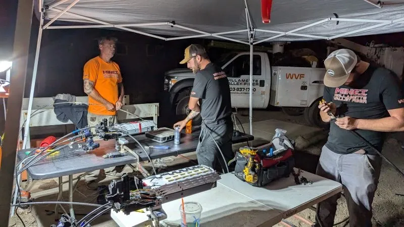 Team working at outdoor event tent